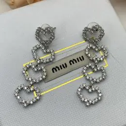 miu miu boucles doreilles pour femme s_1223a66